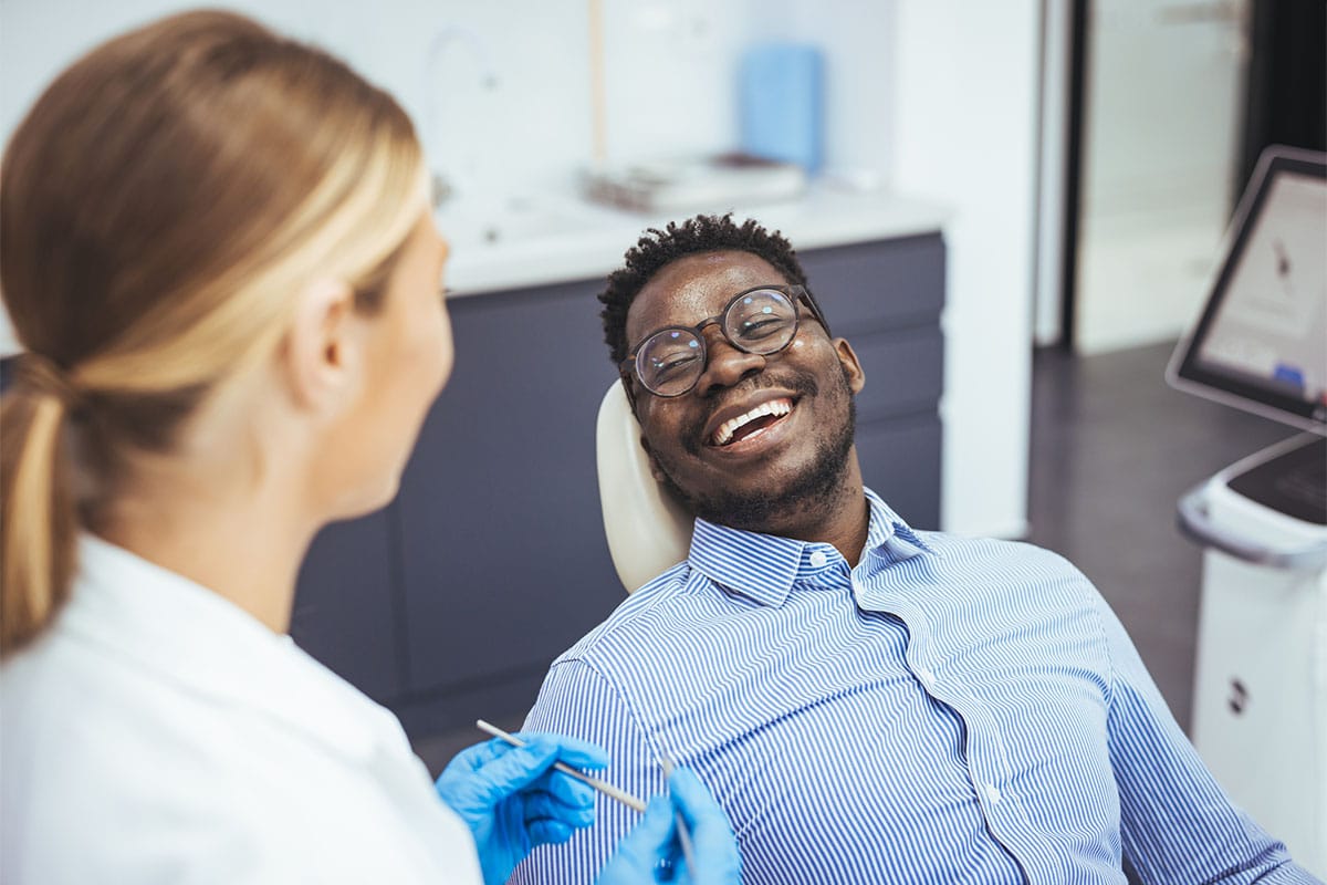 Man getting root canal smiling image
